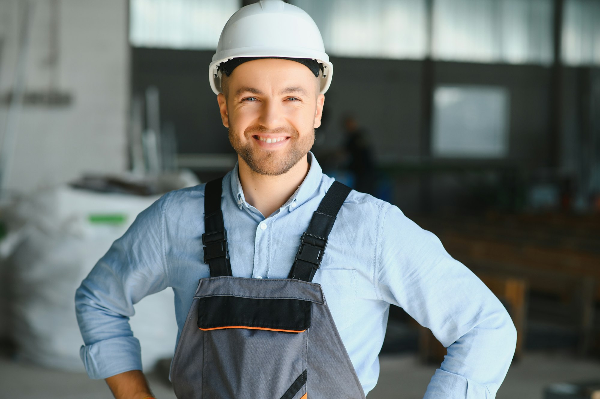 Portrait of factory worker. Young handsome factory worker.